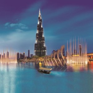 You can experience the Dubai lake fountain show from a boat with stunning views of the Burj Khalifa.