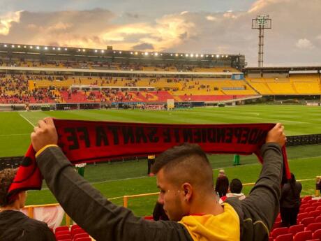 Watch a football match at Bogota's El Campin stadium and enjoy the electric energy of the crowd!