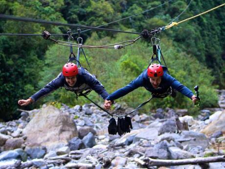 A great couples' activity for gay travellers to Medellin is to go ziplining over the jungle together!