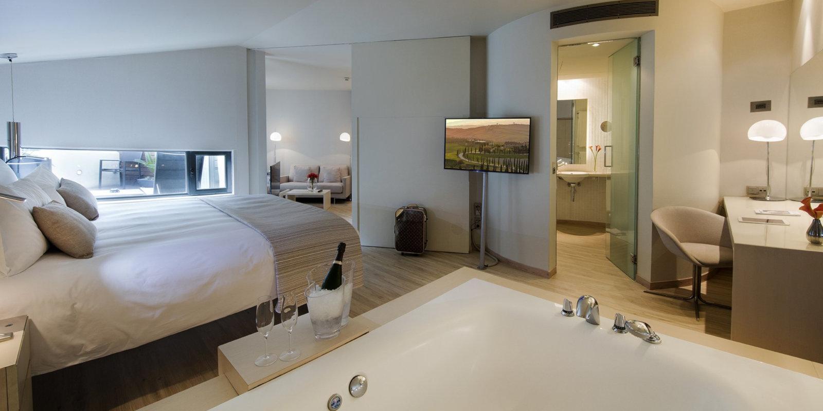 Stay in a spacious suite with a big jacuzzi at the gay friendly Hotel Cram in Barcelona