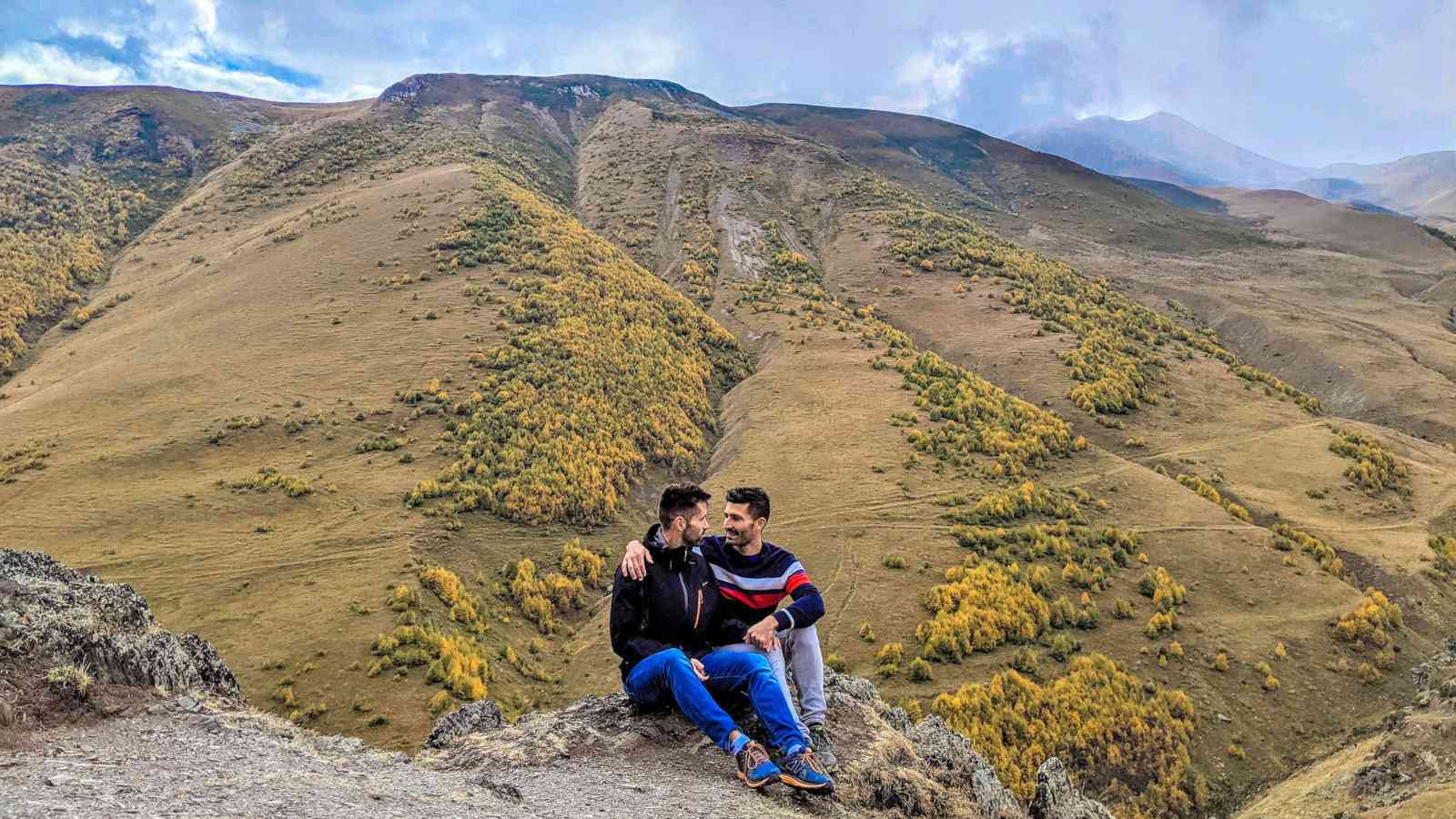 Gay couple trekking in the Kazbegi region of Georgia