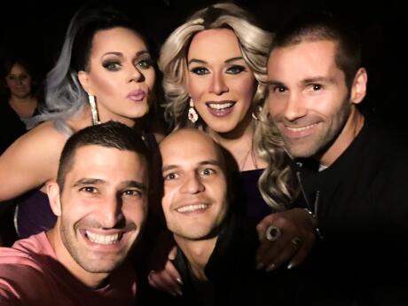 Nomadic Boys hanging out with drag queens at gay bar farinelli in santiago