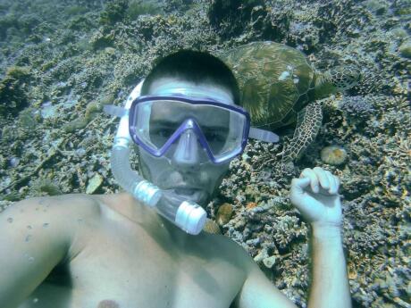 Sebastien snorkelling down to 10 metres to meet this beautiful turtle near Gili T