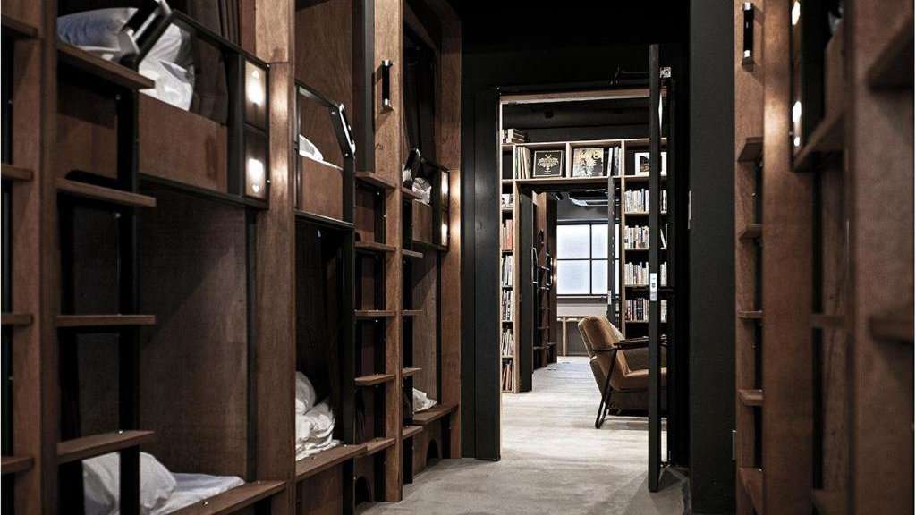 Feel like you're sleeping in a library at the cosy Dorm Hostel in Osaka