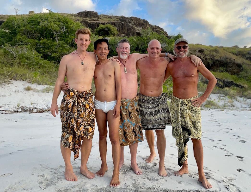 Camaraderie, in a relaxed atmosthere on a beach in komodo national park.