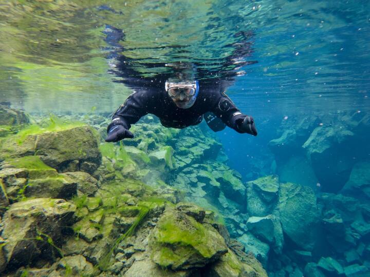 Nomadic Boys snorkeling in Silfra between two continents