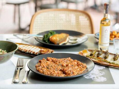 A table with pates of delicious looking food at Dopios restaurant in Athens.