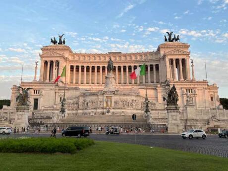 The massive Vittorio Emanuele II Monument in Rome with blue skies behind it.